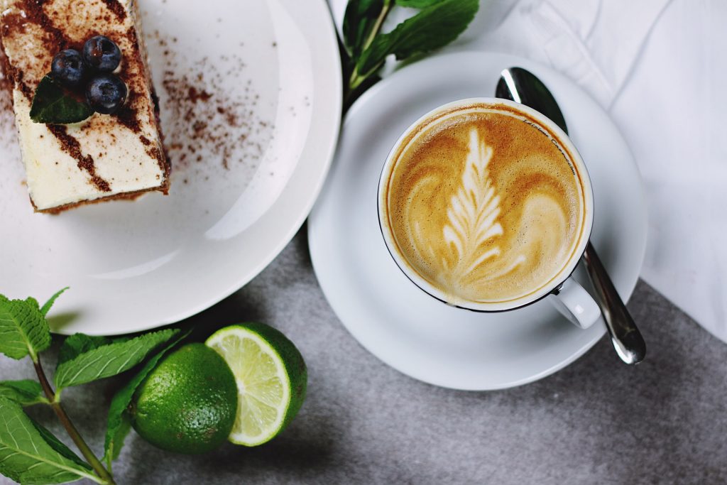 Mug Run Coffee with a slice of cake.